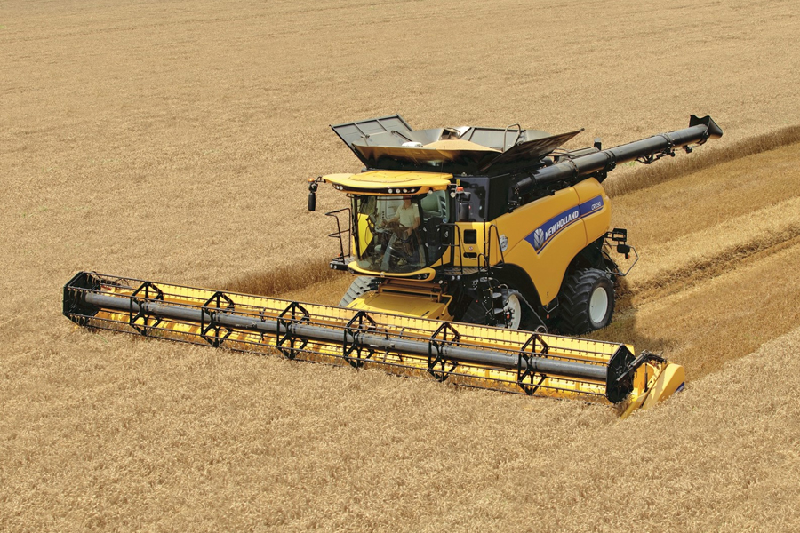 New Holland combine harvester working a wheat field